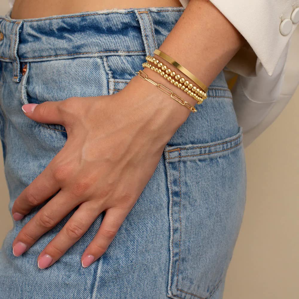 Gold stackable bracelets, designing a cohesive and stylish stack of gold bracelets can be a fun and creative way to accessorize and express your personal style.