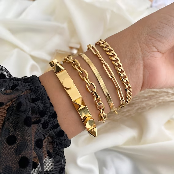 Gold stackable bracelets, designing a cohesive and stylish stack of gold bracelets can be a fun and creative way to accessorize and express your personal style.