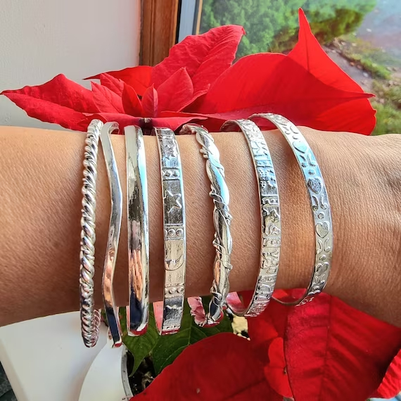 Mexican silver bracelets with different outfits can add a touch of elegance, cultural flair, and individuality to your overall look.