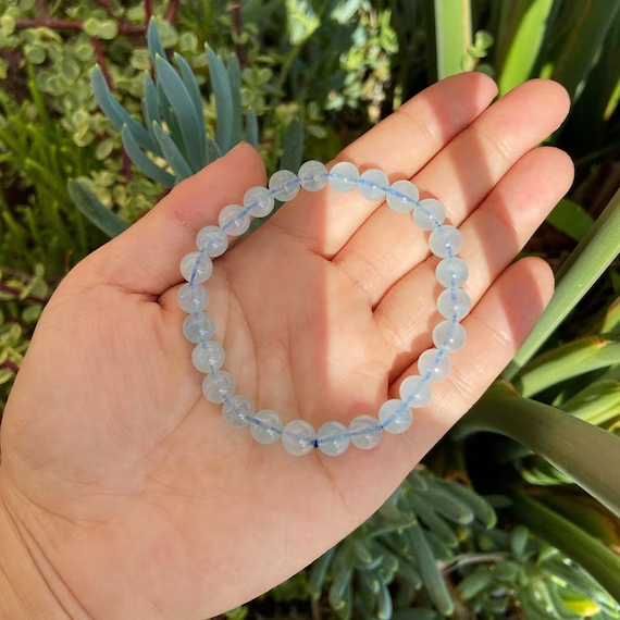Aquamarine bracelets are cherished for their serene blue hues and captivating allure, making them a popular choice for accessorizing various outfits.