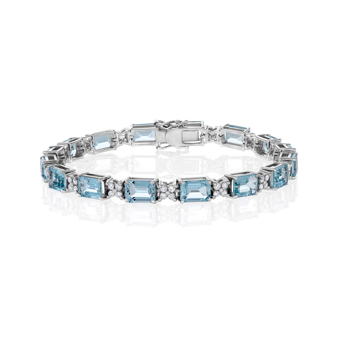Aquamarine bracelets are cherished for their serene blue hues and captivating allure, making them a popular choice for accessorizing various outfits.